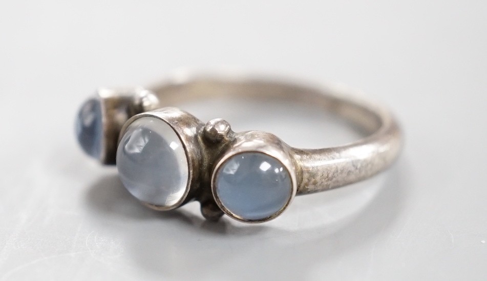 A Georg Jensen sterling 925 and three stone cabochon moonstone set half hoop ring, no. 3, size M/N, in Georg Jensen box.